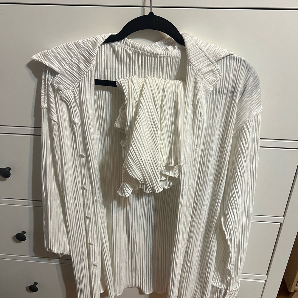 White women’s set. Shorts and a button up long  sleeve. Worn one time!